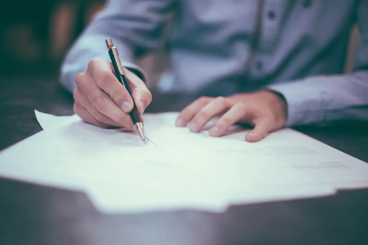 Person signing financing paperwork